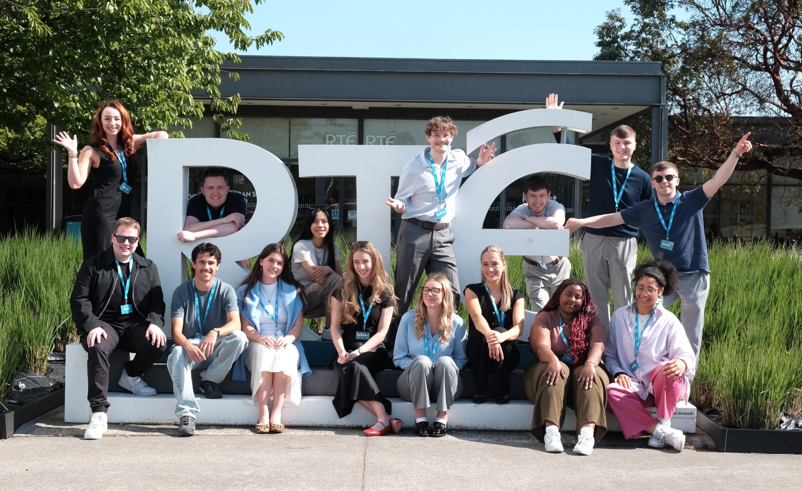 Photograph of Internship employees posing for a photo in front of RTÉ reception.